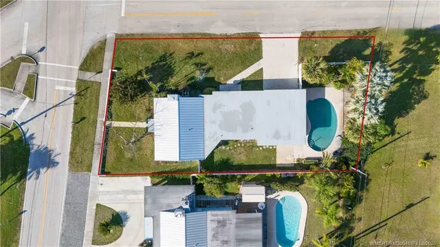 an aerial view of a house with outdoor space