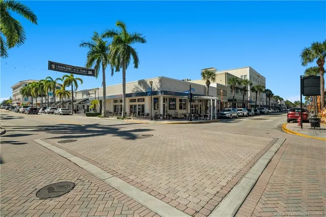 a view of a park with palm trees