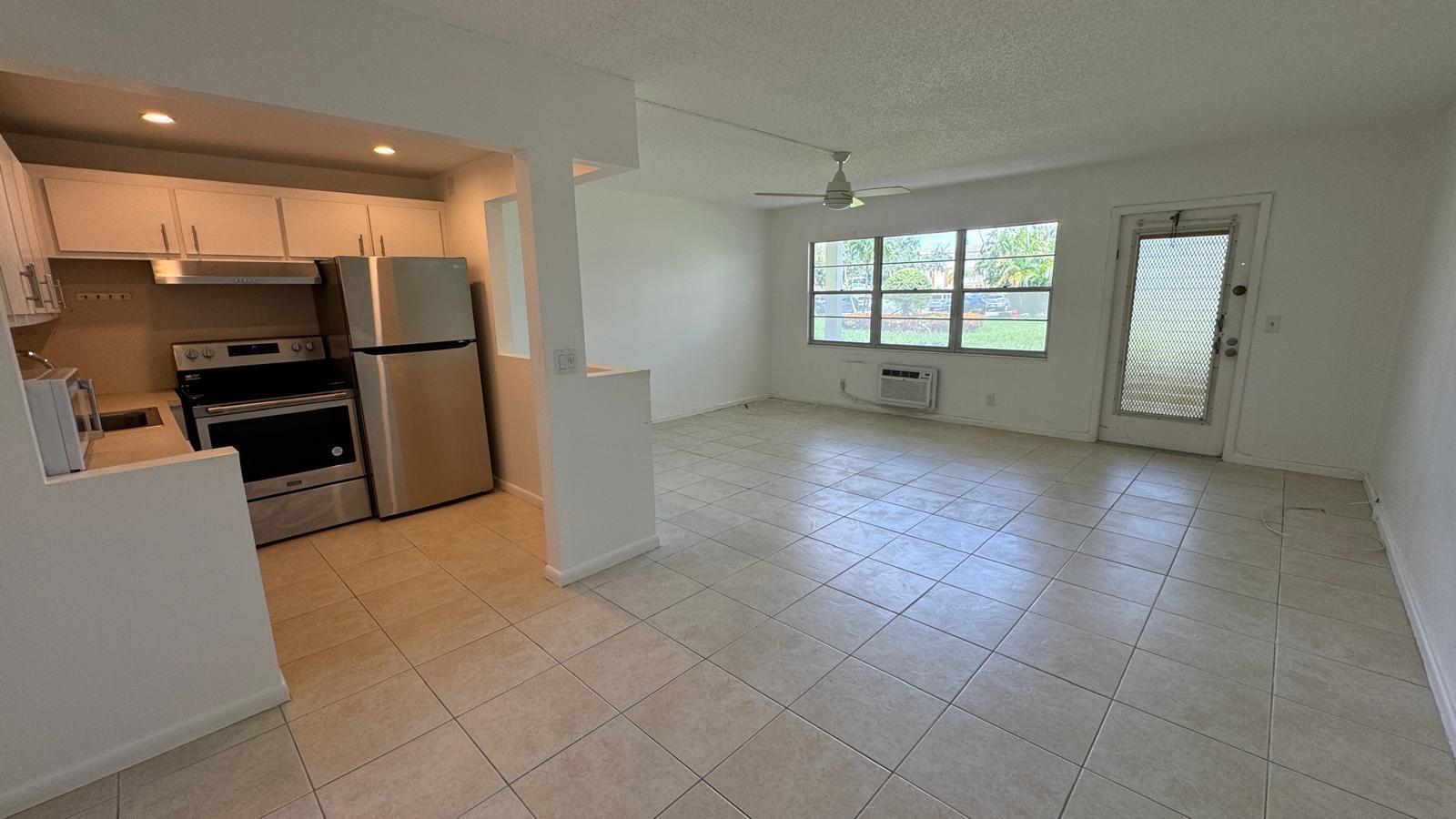 174 Mansfield F, Unit 174 Boca Raton, FL 33434 - Photo 2 of 30 living room - kitchen 1