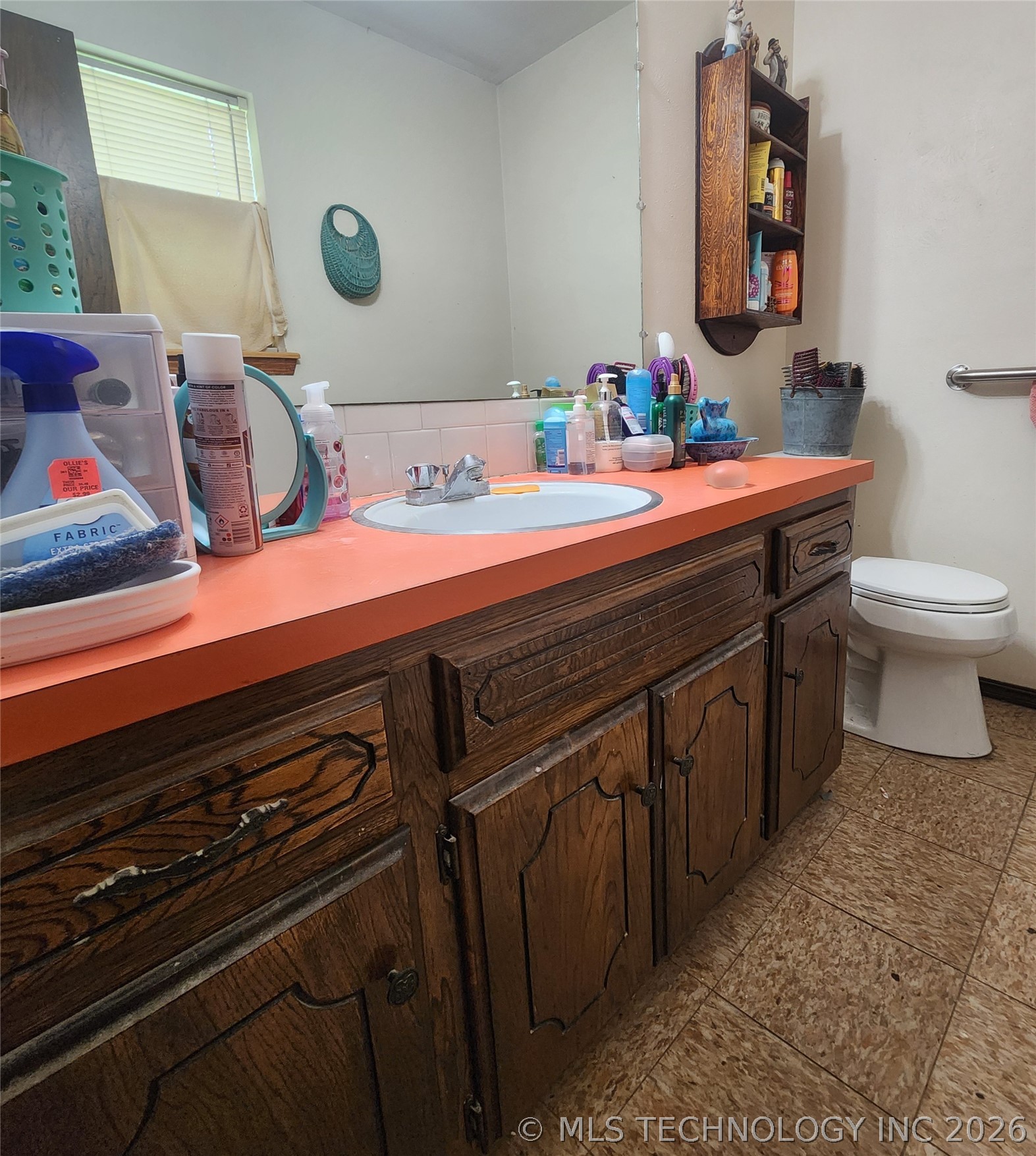 149 West Ruth Atoka, OK 74525 - Photo 35 of 62 Wood-finish vanity with a coral countertop and integrated sink basin