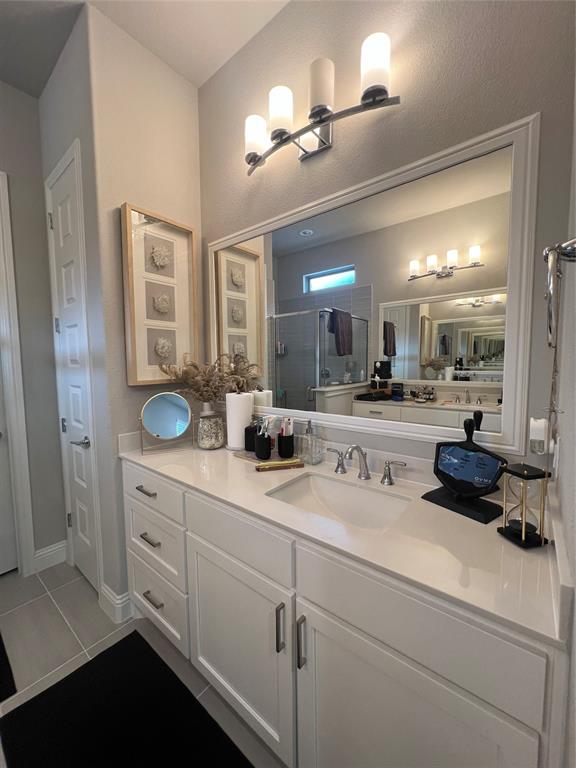 13244 Jonata Street Frisco, TX 75035 - Photo 12 of 20 a bathroom with a sink double vanity and a mirror