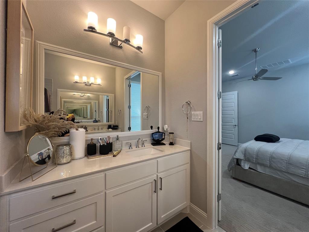 13244 Jonata Street Frisco, TX 75035 - Photo 13 of 20 a en suite bathroom with double sink and a mirror