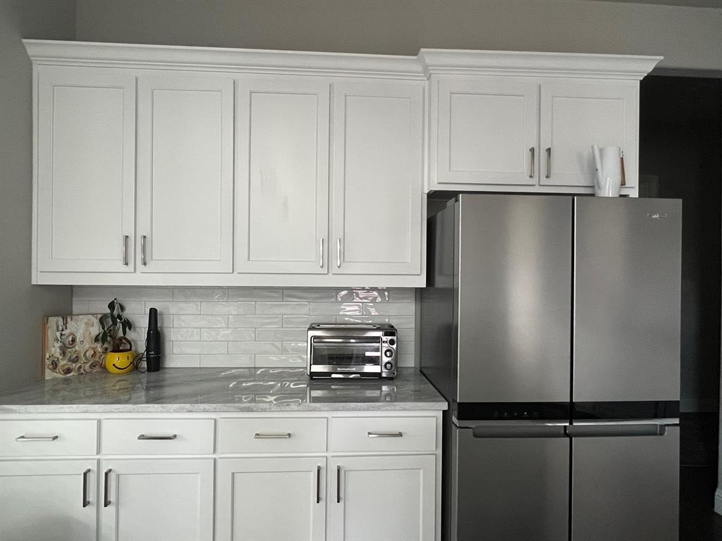 13244 Jonata Street Frisco, TX 75035 - Photo 5 of 20 a kitchen with appliances cabinets and a counter top space
