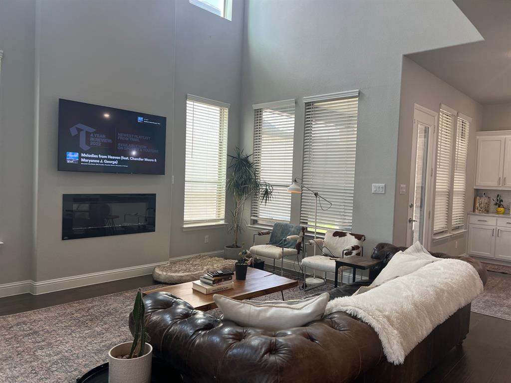 13244 Jonata Street Frisco, TX 75035 - Photo 9 of 20 a living room with furniture and a fireplace