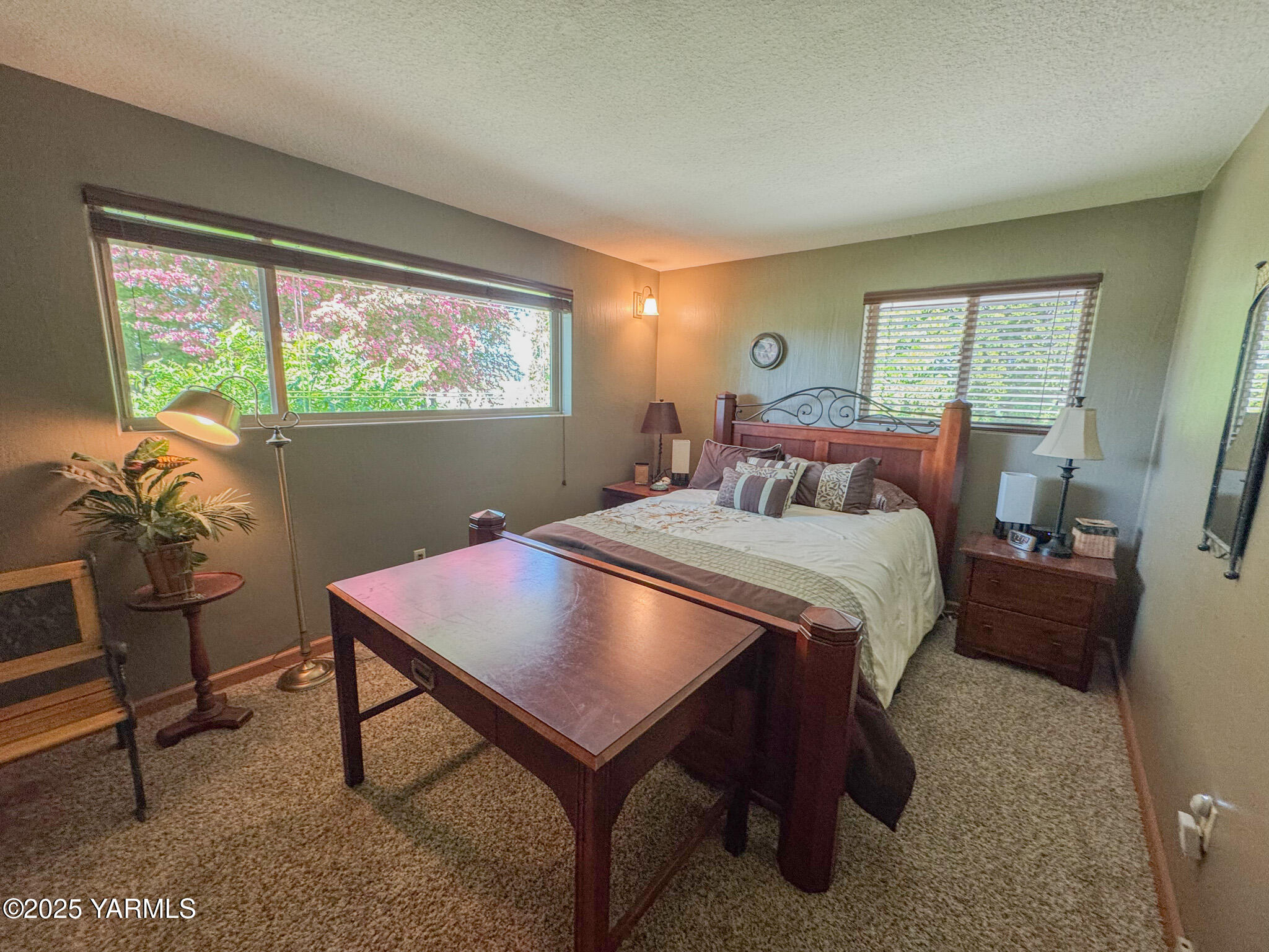 1450 Scoon Road Sunnyside, WA 98944 - Photo 11 of 33 a bedroom with a bed and large windows