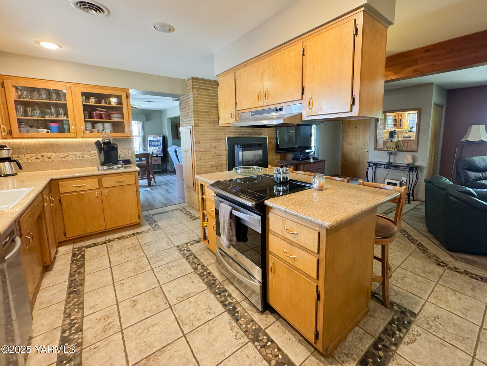1450 Scoon Road Sunnyside, WA 98944 - Photo 9 of 33 a kitchen with a stove top oven cabinets a sink and a counter top space