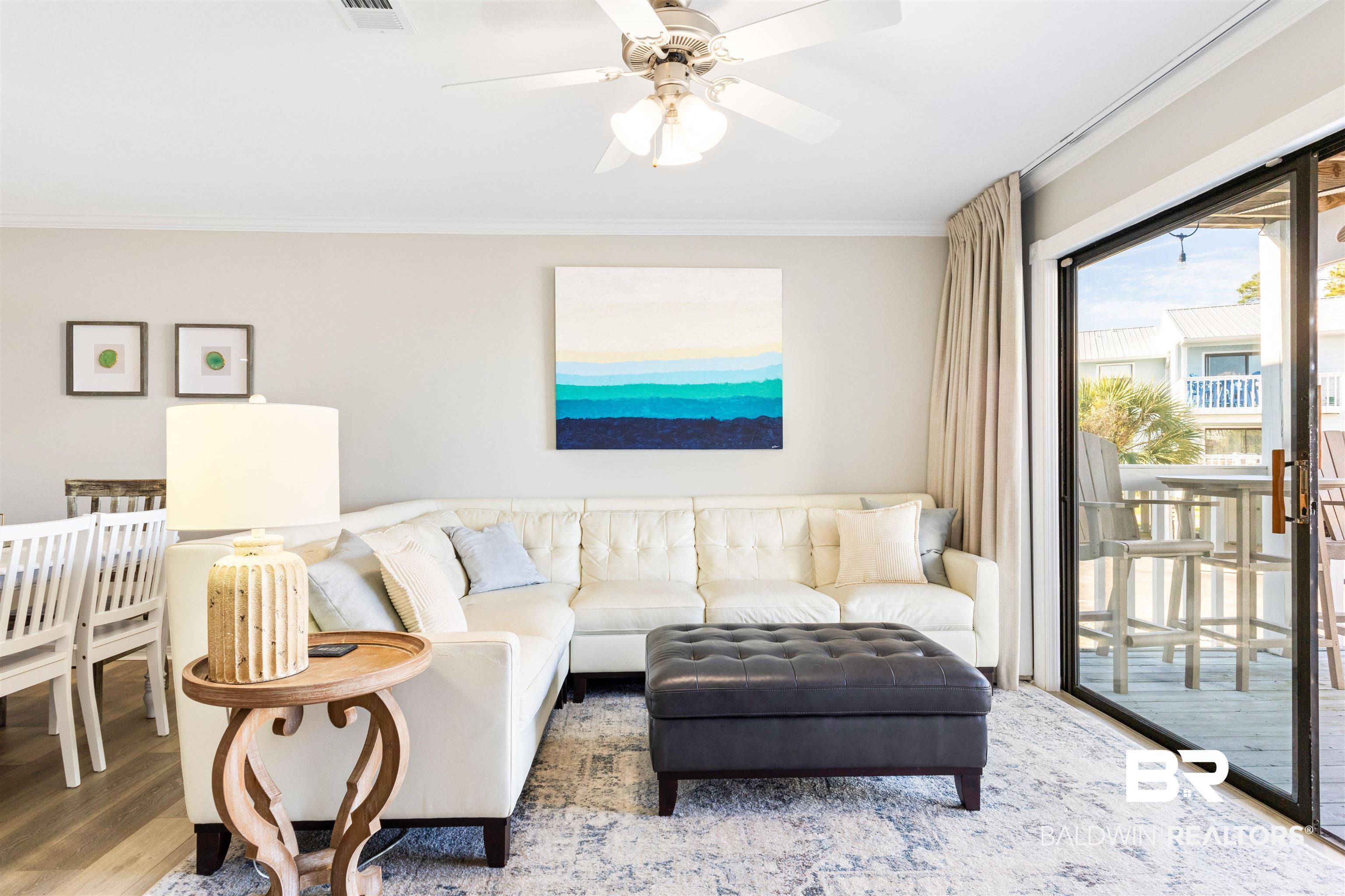25861 Canal Road, Unit 3 Orange Beach, AL 36561 - Photo 12 of 40 Living area with crown molding, wood finished floors, and ceiling fan