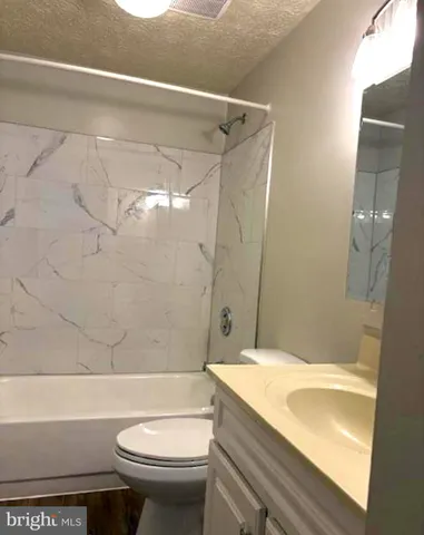 a bathroom with a sink and shower