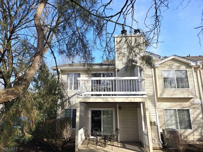 80 Sage Court Bedminster, NJ 07921 - Photo 4 of 4 a front view of residential houses with yard and car parked