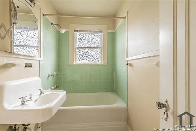 a bathroom with a sink and a bathtub