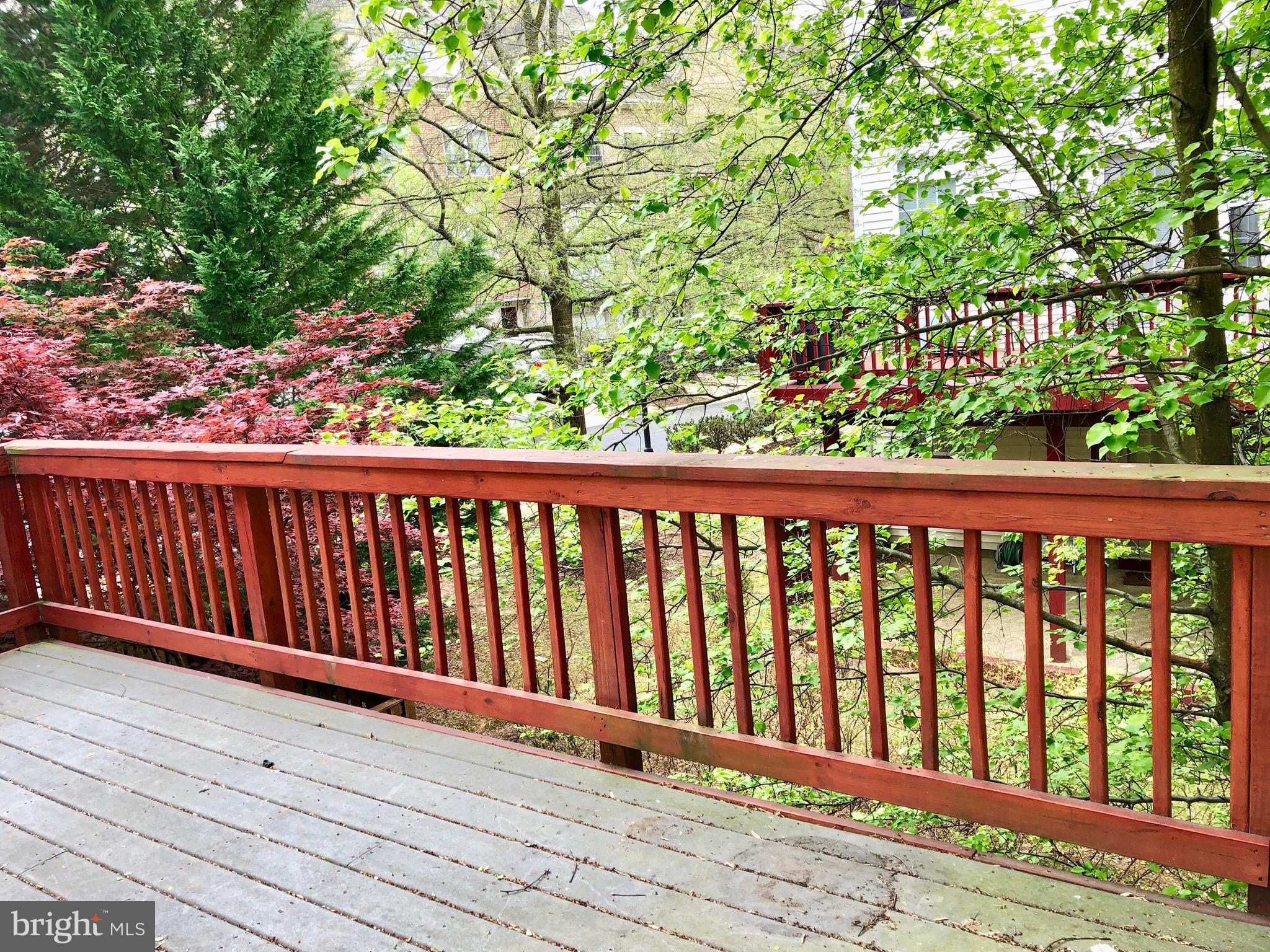 6402 Spring View Place Rockville, MD 20852 - Photo 13 of 25 a view of balcony with wooden floor