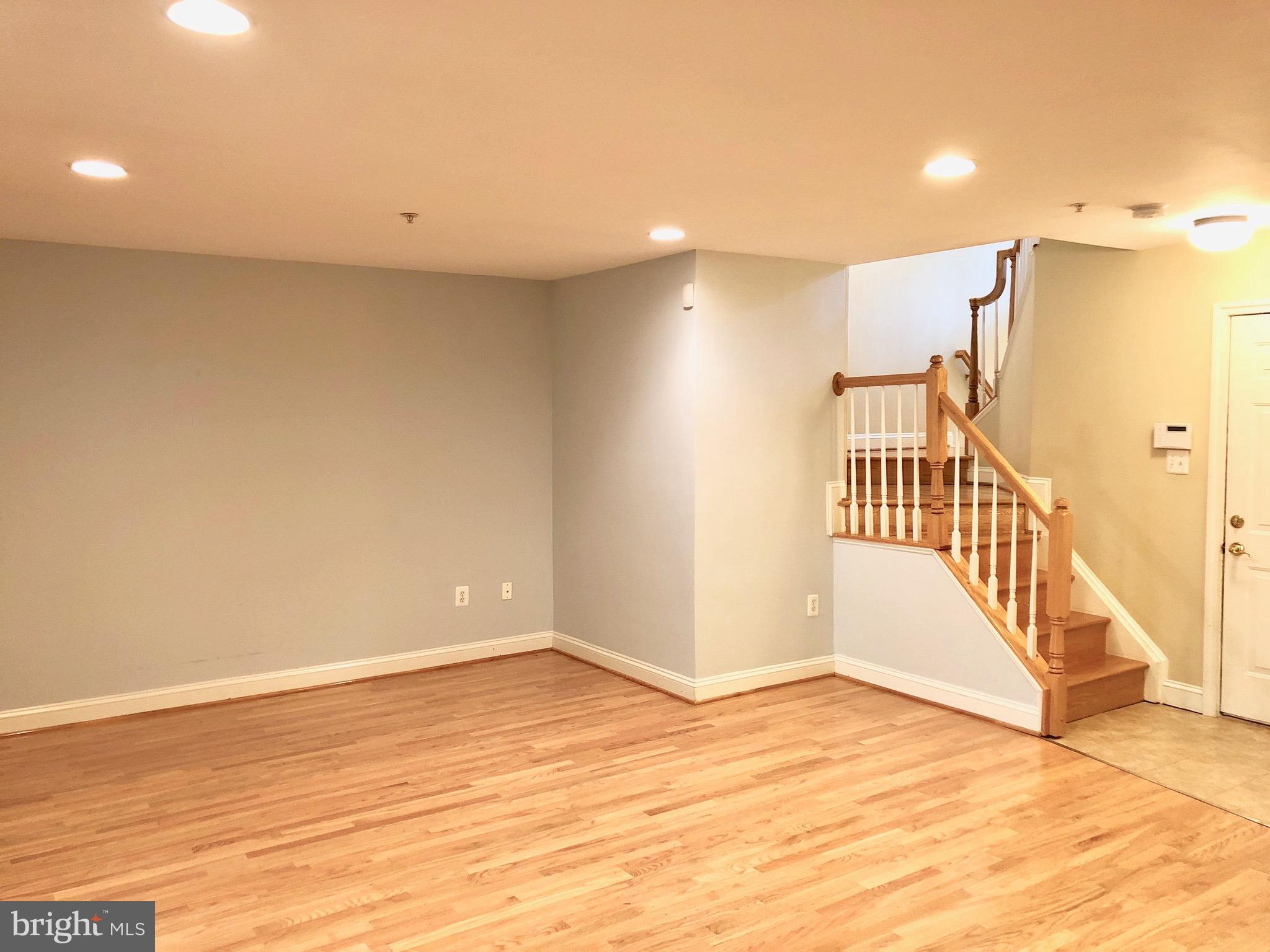 6402 Spring View Place Rockville, MD 20852 - Photo 15 of 25 a view of entryway with wooden floor
