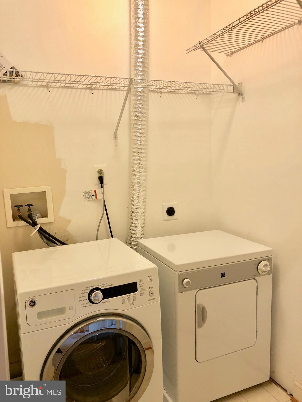 6402 Spring View Place Rockville, MD 20852 - Photo 24 of 25 a utility room with dryer and washer