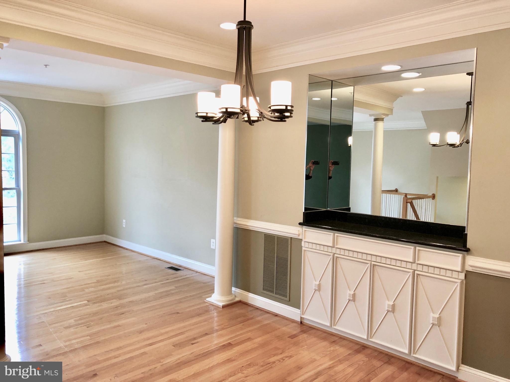 6402 Spring View Place Rockville, MD 20852 - Photo 5 of 25 a bathroom with a sink and a mirror
