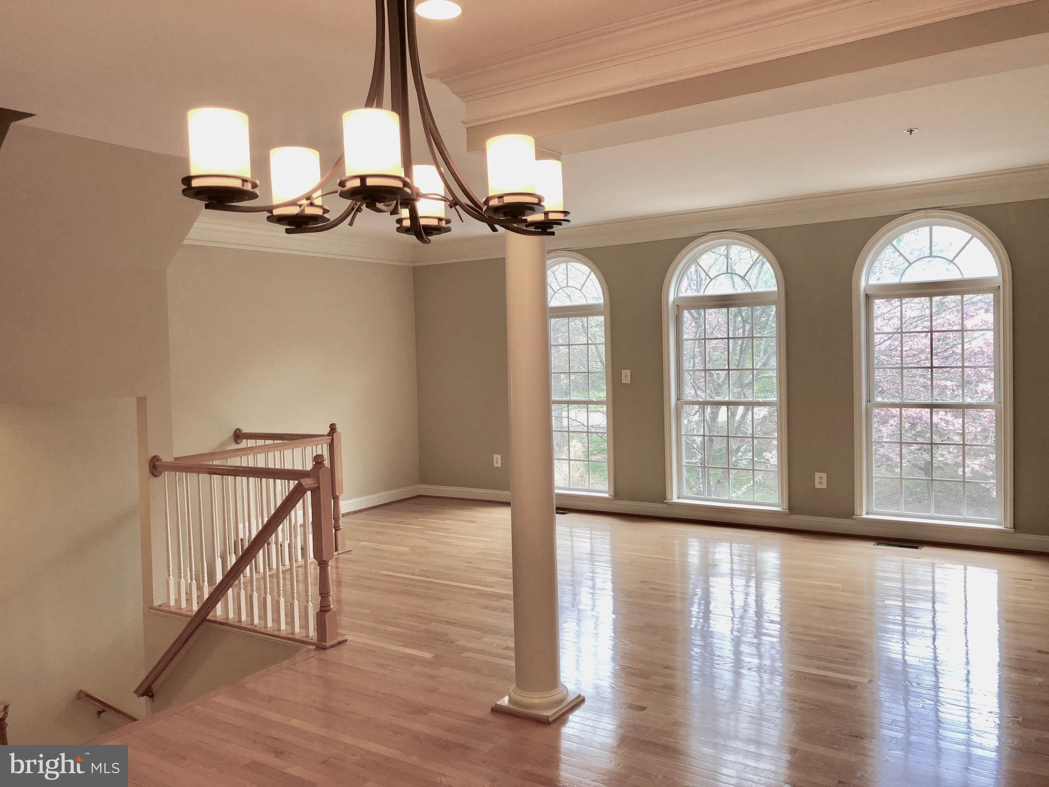 6402 Spring View Place Rockville, MD 20852 - Photo 6 of 25 a view of hall way with wooden floor and windows