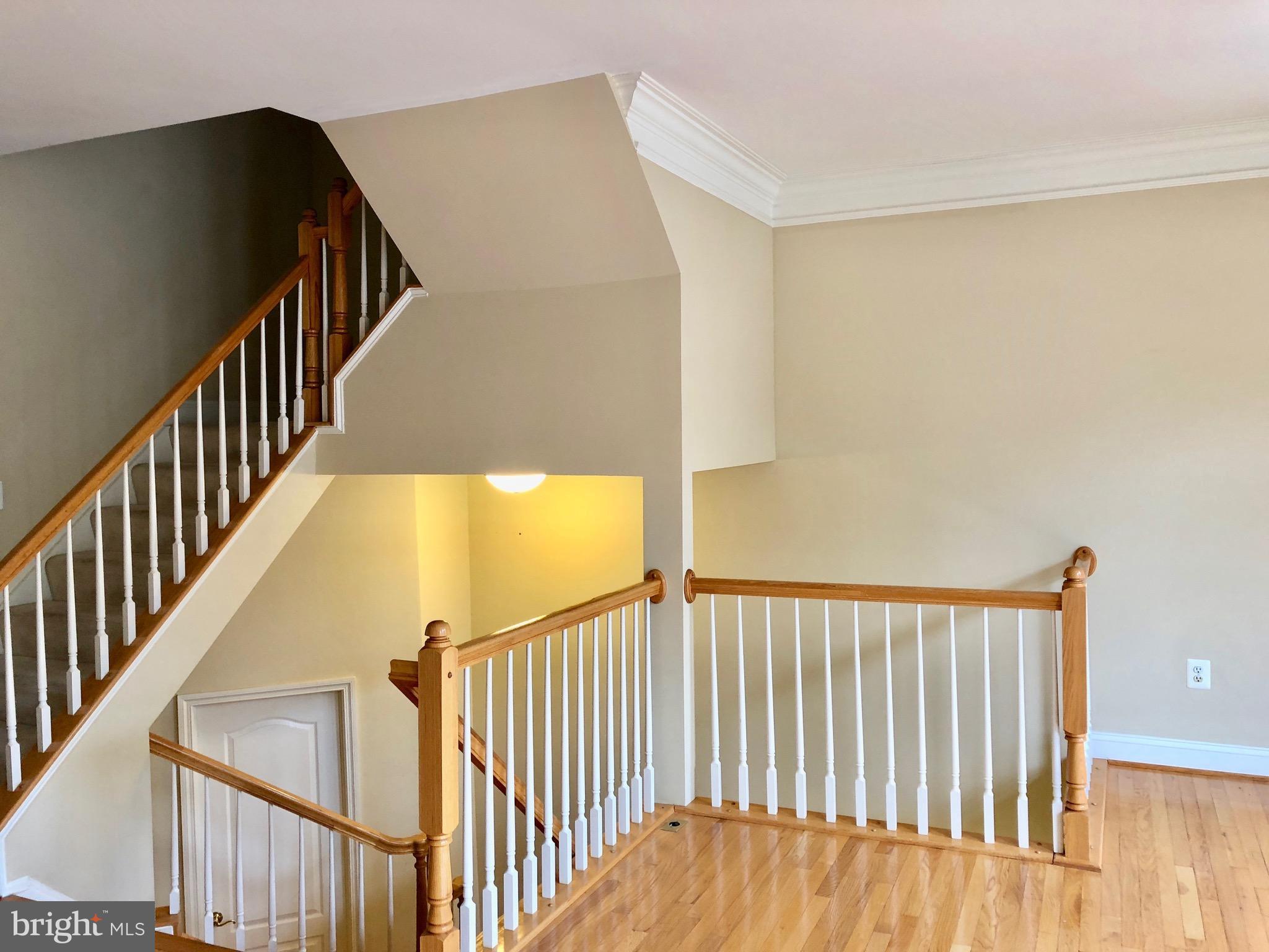 6402 Spring View Place Rockville, MD 20852 - Photo 7 of 25 a view of staircase with railing and a window