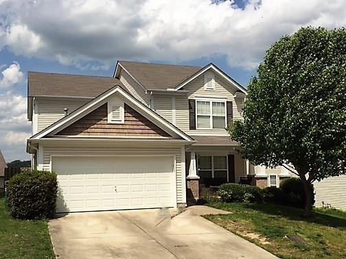 3932 Stephens Ridge Way Antioch, TN 37013 - Photo 1 of 12 a front view of a house with a yard and garage