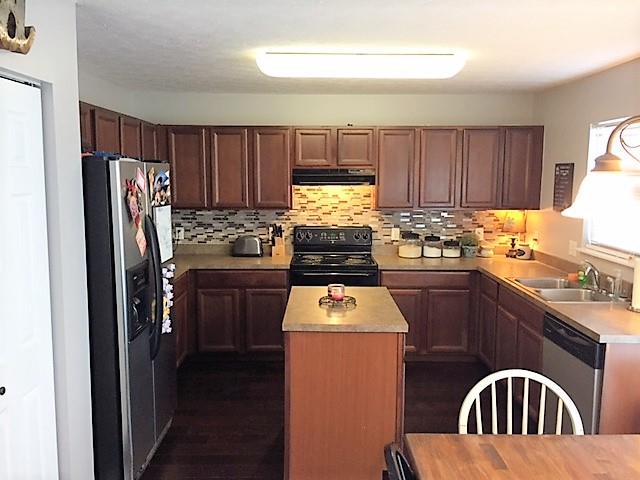 3932 Stephens Ridge Way Antioch, TN 37013 - Photo 7 of 12 a kitchen with stainless steel appliances granite countertop a refrigerator stove and sink