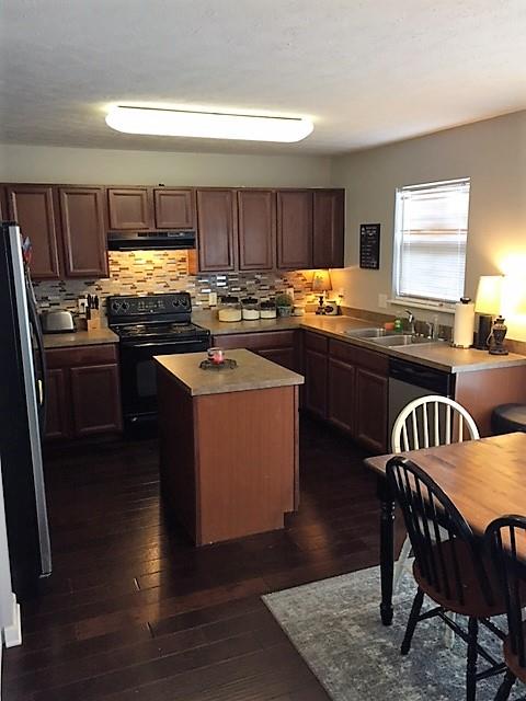 3932 Stephens Ridge Way Antioch, TN 37013 - Photo 8 of 12 a kitchen with stainless steel appliances granite countertop a stove top oven a sink dishwasher and white cabinets with wooden floor