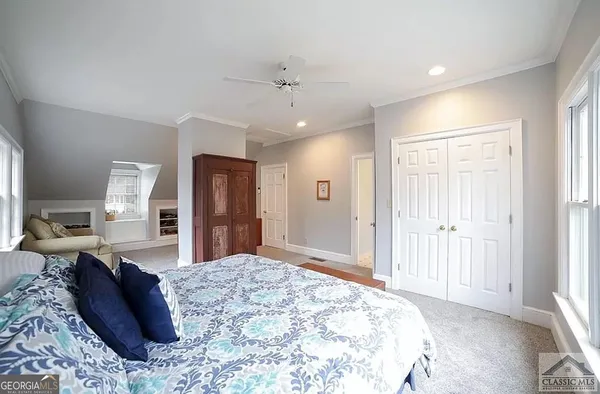 a bed room with a bed and dresser