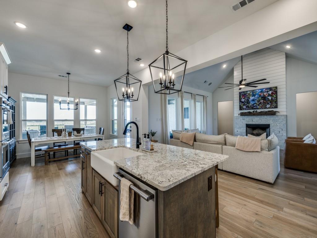 1956 Jc Maples Road Gunter, TX 75058 - Photo 13 of 38 a living room with granite countertop kitchen island furniture and wooden floor