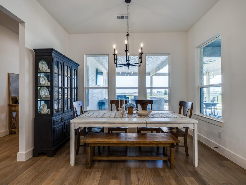 1956 Jc Maples Road Gunter, TX 75058 - Photo 15 of 38 a view of a dining room with furniture window and wooden floor