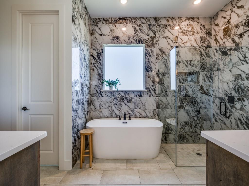 1956 Jc Maples Road Gunter, TX 75058 - Photo 18 of 38 a bathroom with a bathtub and shower