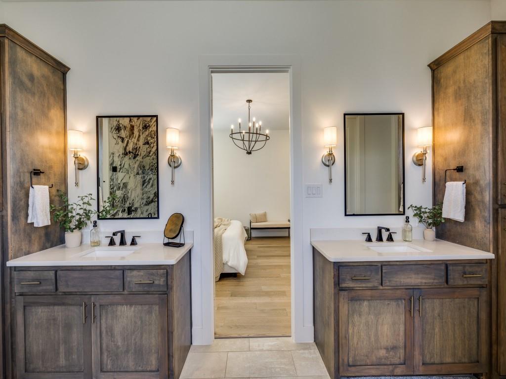 1956 Jc Maples Road Gunter, TX 75058 - Photo 19 of 38 a bathroom with a sink vanity and mirror