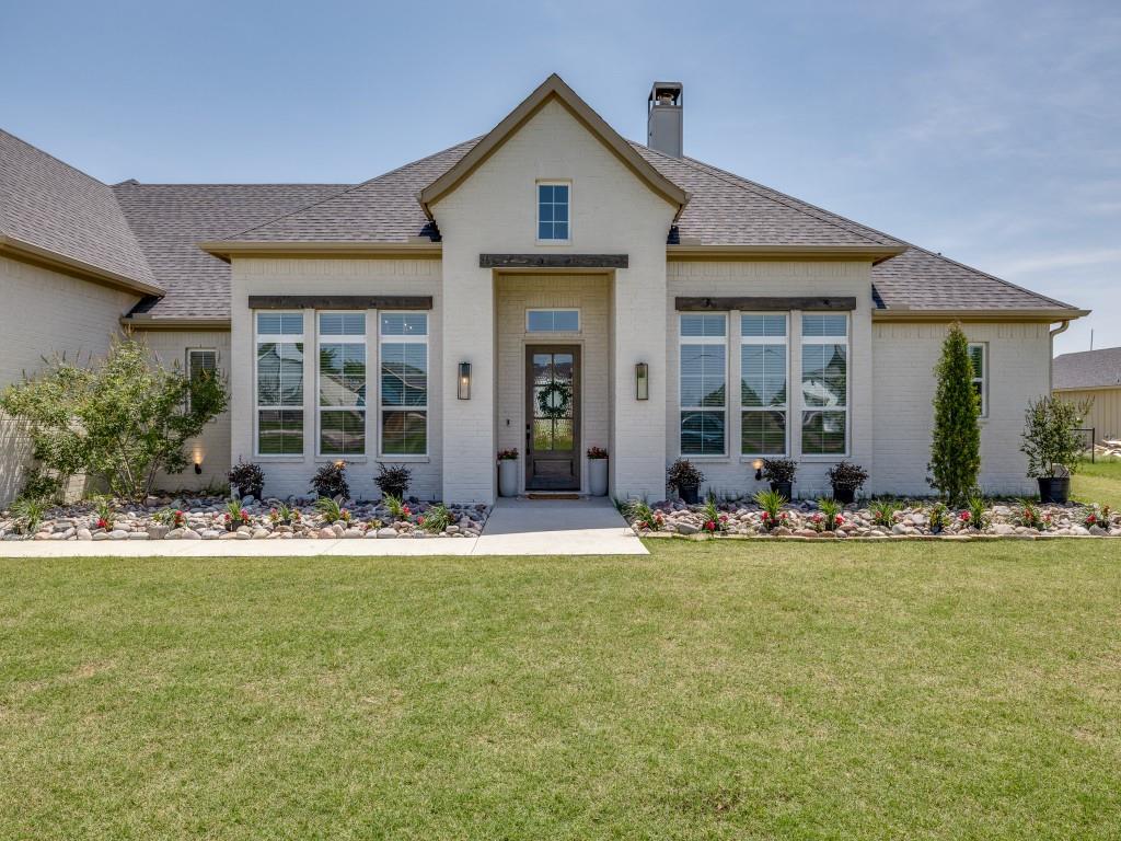 1956 Jc Maples Road Gunter, TX 75058 - Photo 2 of 38 a front view of a house with swimming pool and porch with seating space