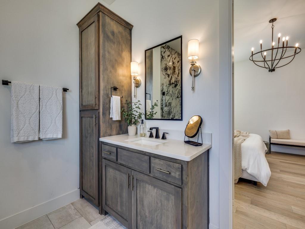 1956 Jc Maples Road Gunter, TX 75058 - Photo 22 of 38 a bathroom with a sink a mirror and shower