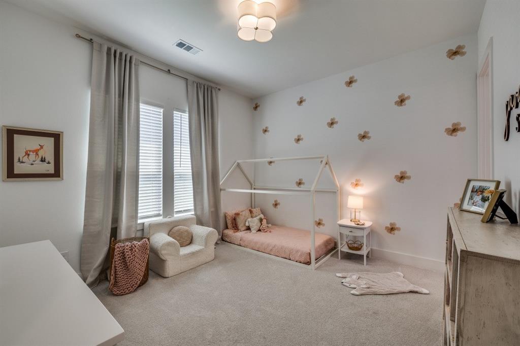 1956 Jc Maples Road Gunter, TX 75058 - Photo 23 of 38 a bedroom with furniture and a large window