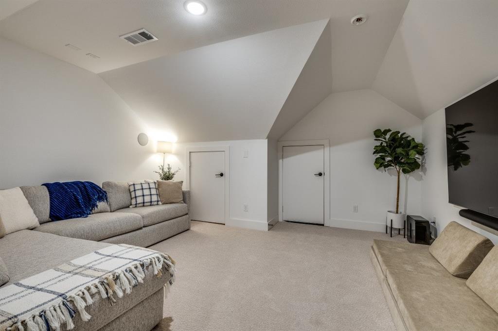 1956 Jc Maples Road Gunter, TX 75058 - Photo 31 of 38 a living room with furniture a potted plant and a flat screen tv