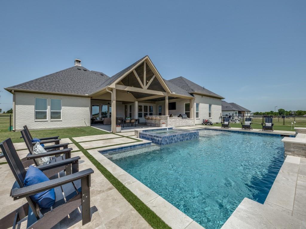 1956 Jc Maples Road Gunter, TX 75058 - Photo 37 of 38 a front view of a house with swimming pool having outdoor seating