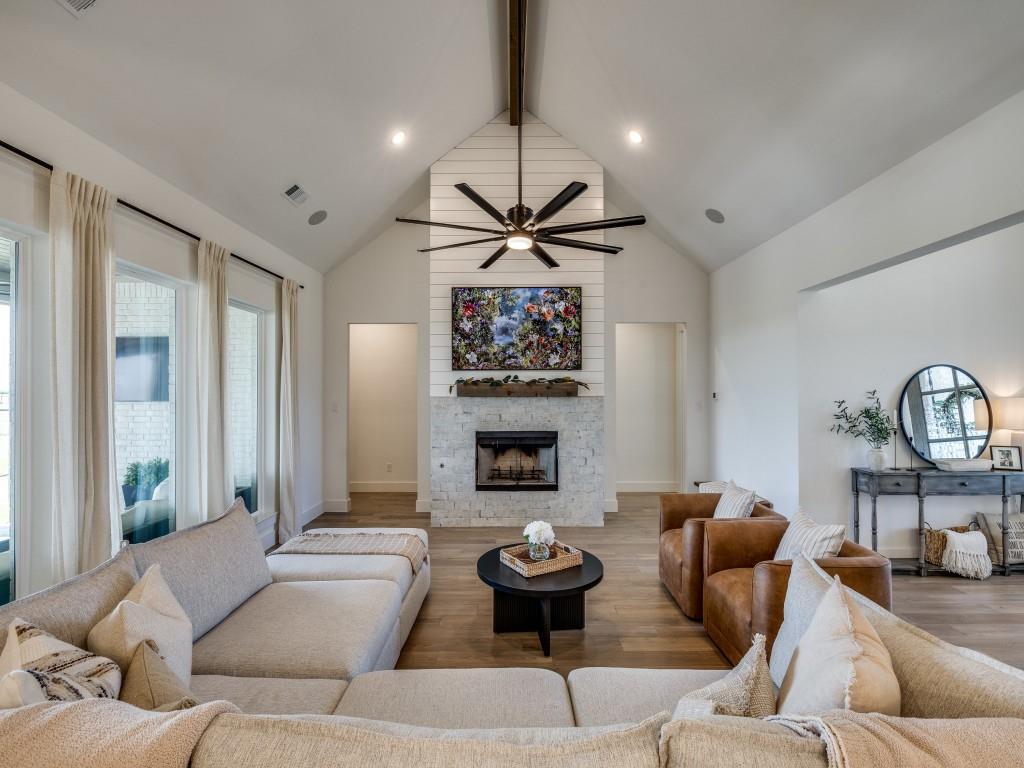 1956 Jc Maples Road Gunter, TX 75058 - Photo 8 of 38 a living room with furniture a fireplace and a large window