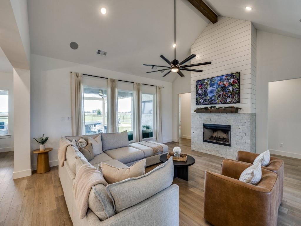 1956 Jc Maples Road Gunter, TX 75058 - Photo 9 of 38 a living room with furniture a fireplace and a flat screen tv