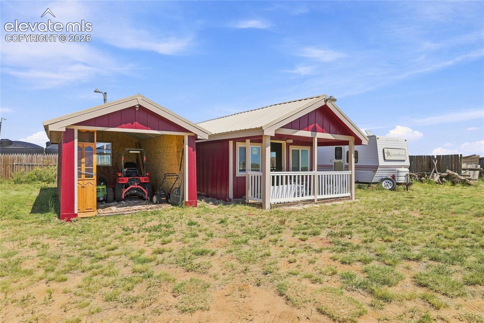 1497 County Road South Rush, CO 80833 - Photo 20 of 29 Kids playhouse and storage/parking