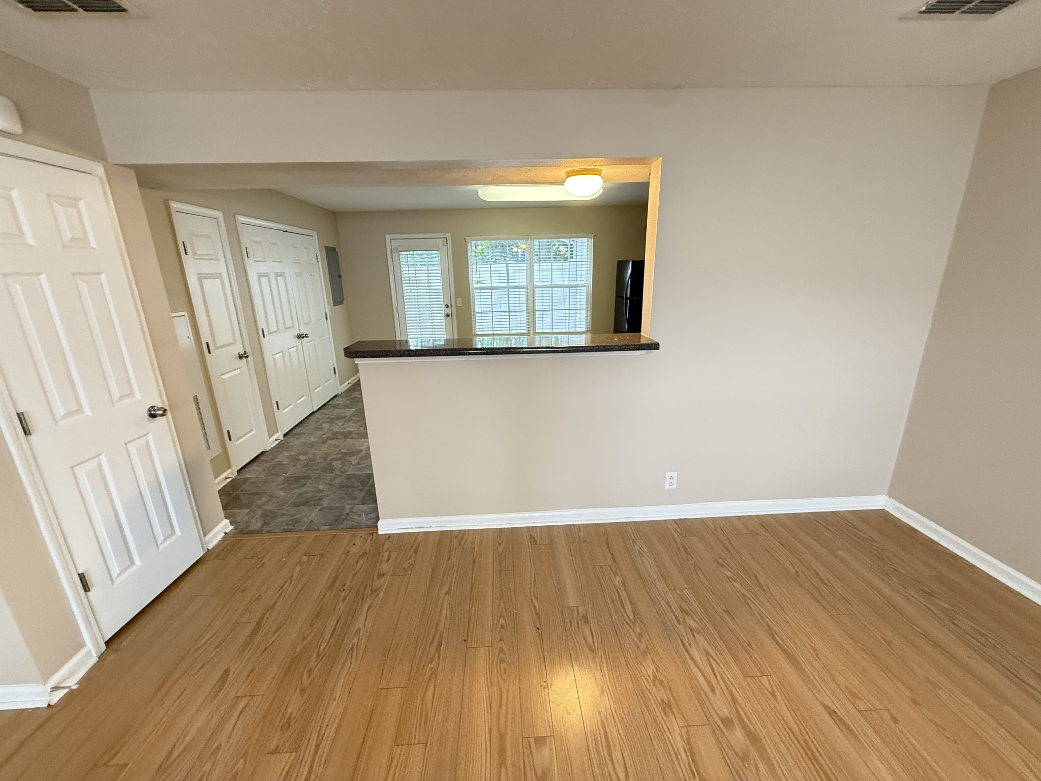 3055 London View Murfreesboro, TN 37128 - Photo 3 of 12 a view of an empty room with wooden floor and a window