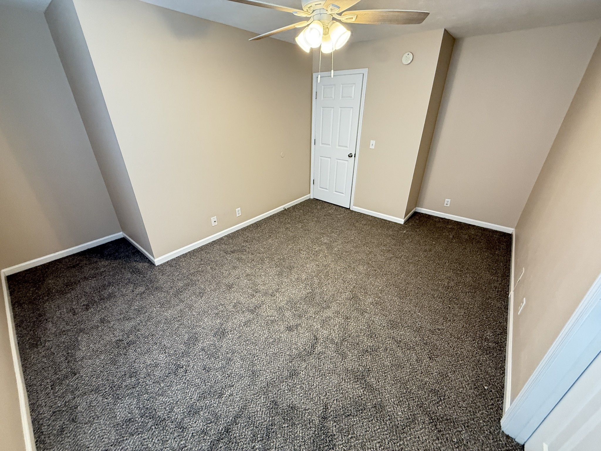 3055 London View Murfreesboro, TN 37128 - Photo 10 of 12 an empty room with a chandelier fan and wooden floor
