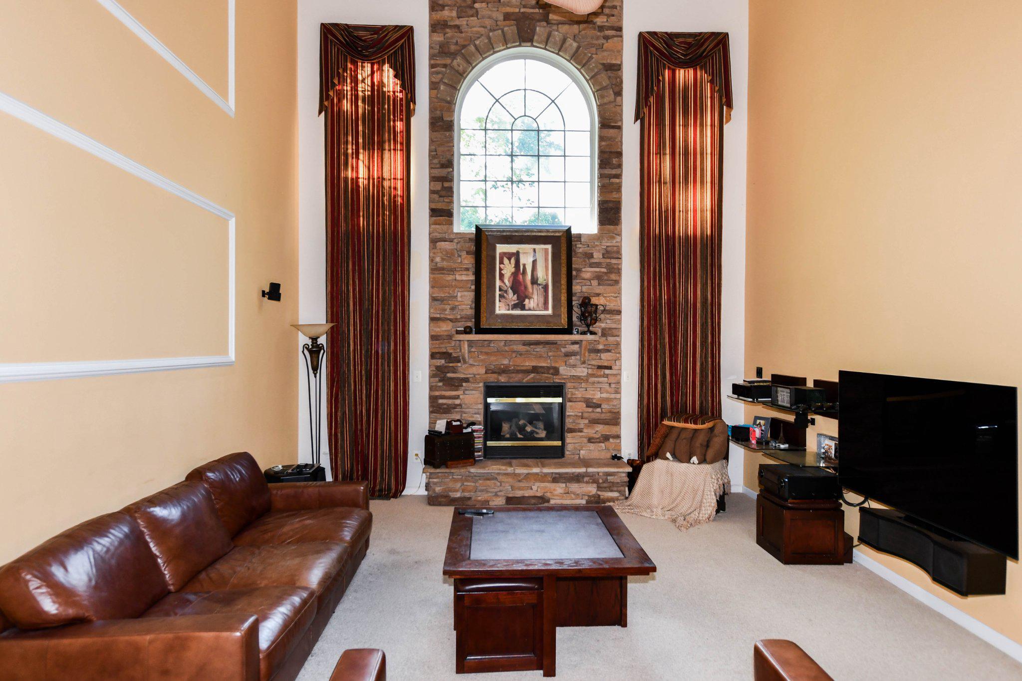 3208 Clavier Place Clinton, MD 20735 - Photo 11 of 55 Elegant family room with stone accents.