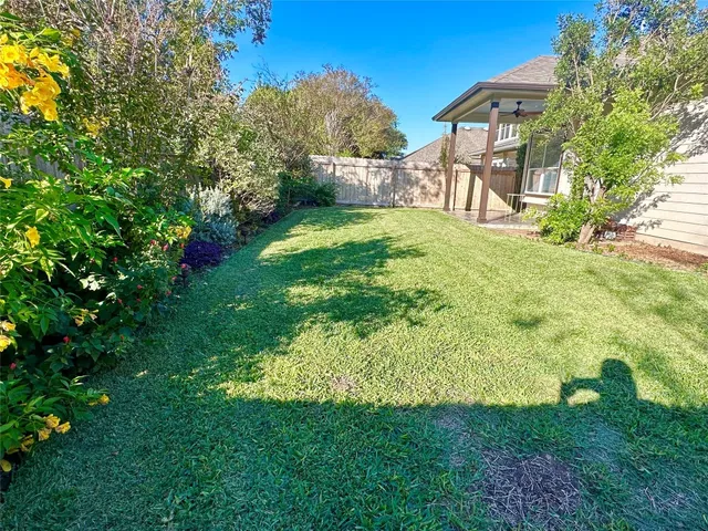 a view of a backyard with a garden