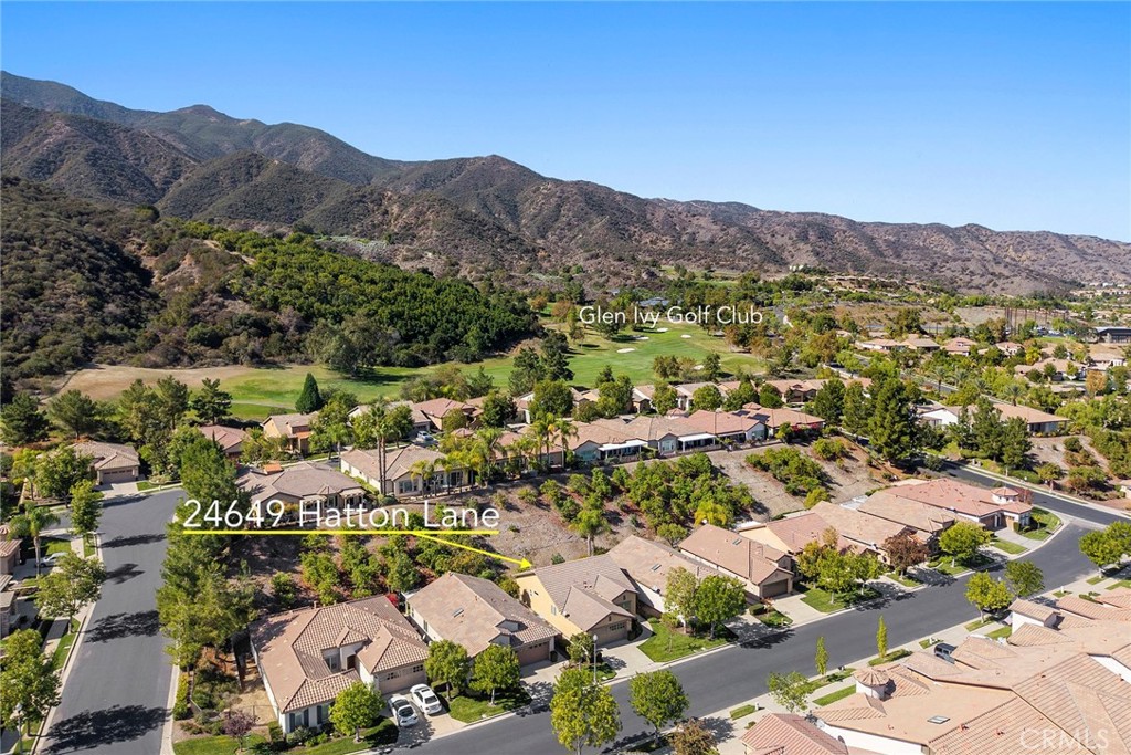 an aerial view of residential house and green space