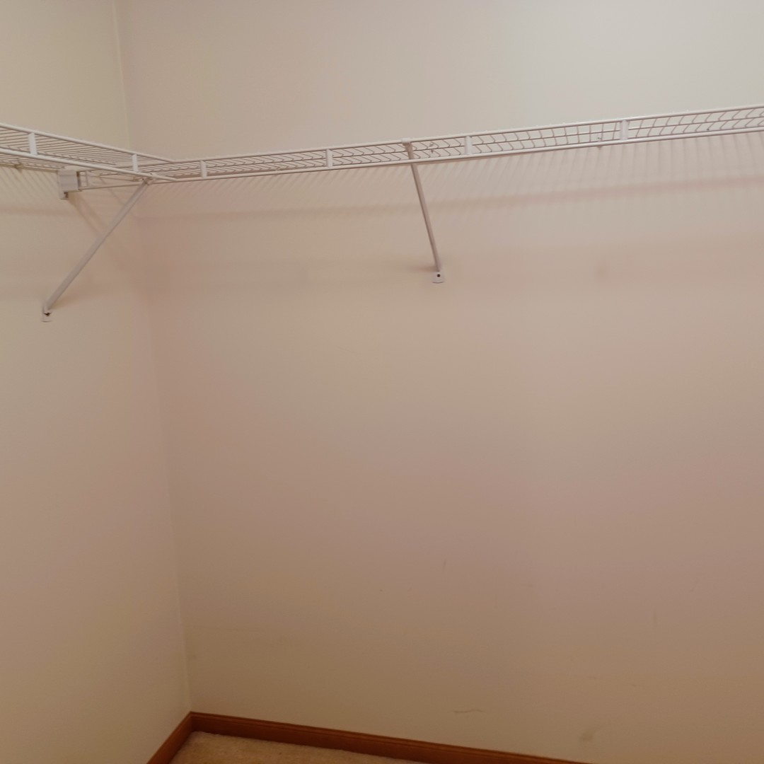 26 Vermont Avenue Bloomington, IL 61701 - Photo 11 of 15 a view of a room with racks on the wall
