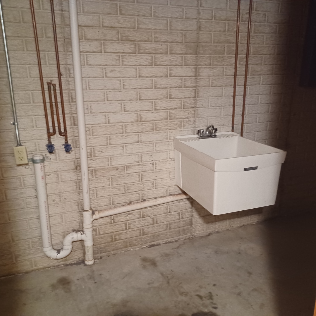 26 Vermont Avenue Bloomington, IL 61701 - Photo 13 of 15 a bathroom with a sink a toilet and shower