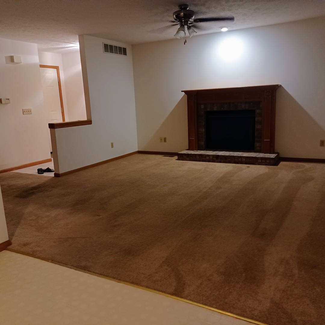 26 Vermont Avenue Bloomington, IL 61701 - Photo 2 of 15 a view of empty room with a fireplace