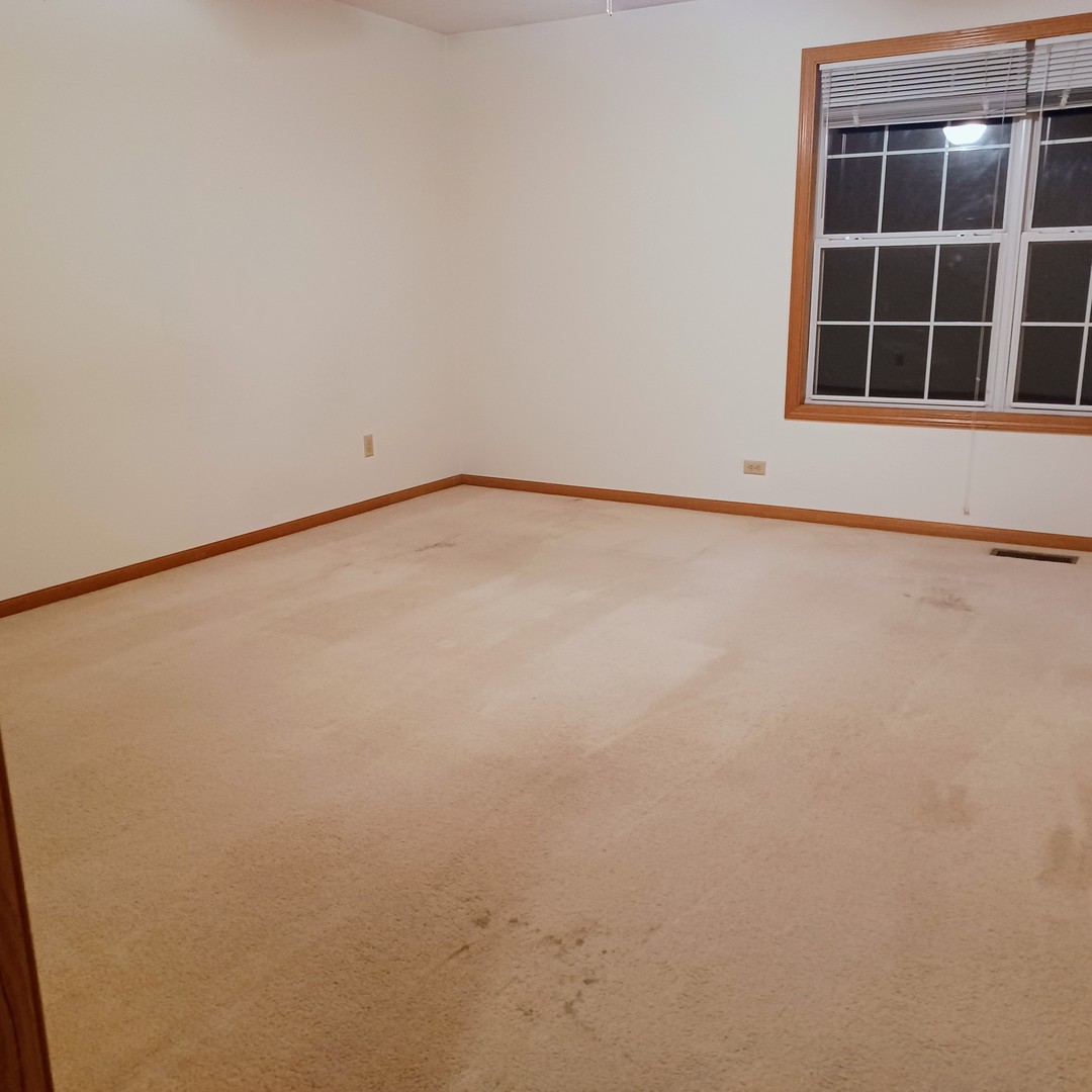 26 Vermont Avenue Bloomington, IL 61701 - Photo 6 of 15 a view of an empty room with a window