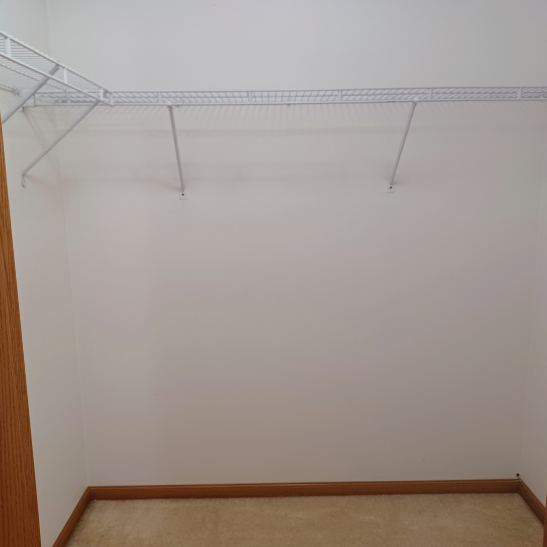 26 Vermont Avenue Bloomington, IL 61701 - Photo 8 of 15 a view of a room with racks on the wall