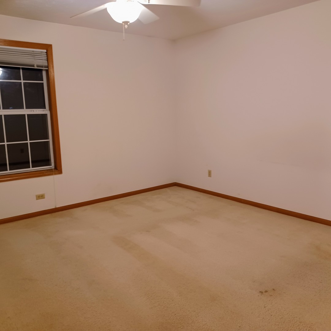 26 Vermont Avenue Bloomington, IL 61701 - Photo 9 of 15 a view of an empty room with a window
