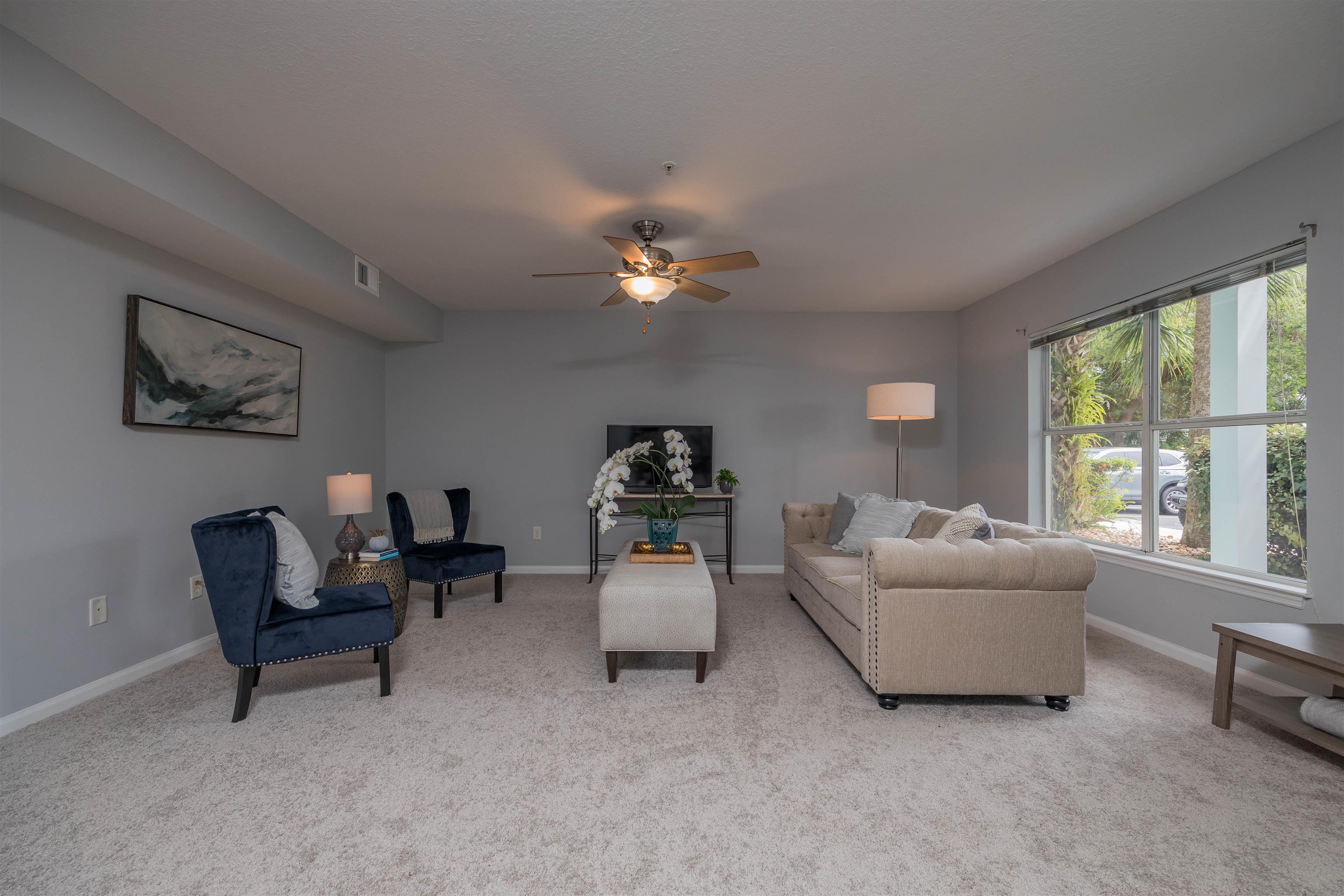 208 16th Street, Unit B St. Augustine, FL 32080 - Photo 12 of 68 a living room with furniture and a large window