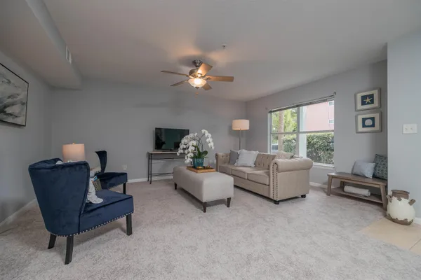 a living room with furniture and a flat screen tv