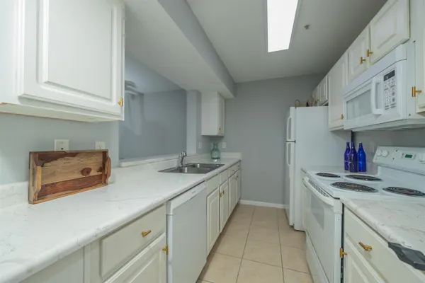 a kitchen that has a sink and a stove